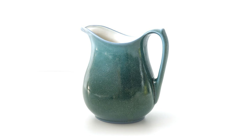 classic curvy slip cast copper oxide green glazed porcelain jug