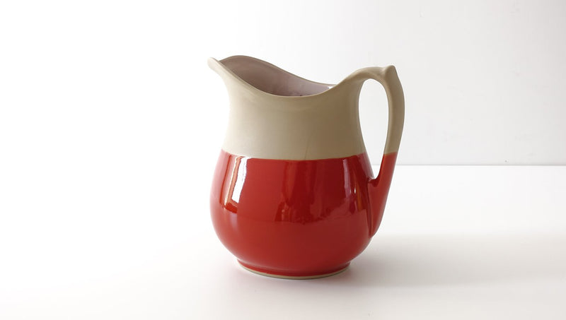 classic curvy slip cast brick red glazed porcelain jug